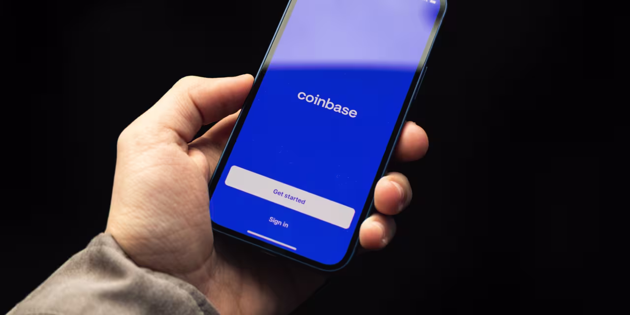 Coinbase Cuts 14% of Workforce in ‘AI-Native’ Pivot. The Stock Jumps.