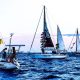 Global Sumud Flotilla boats sailing at twilight