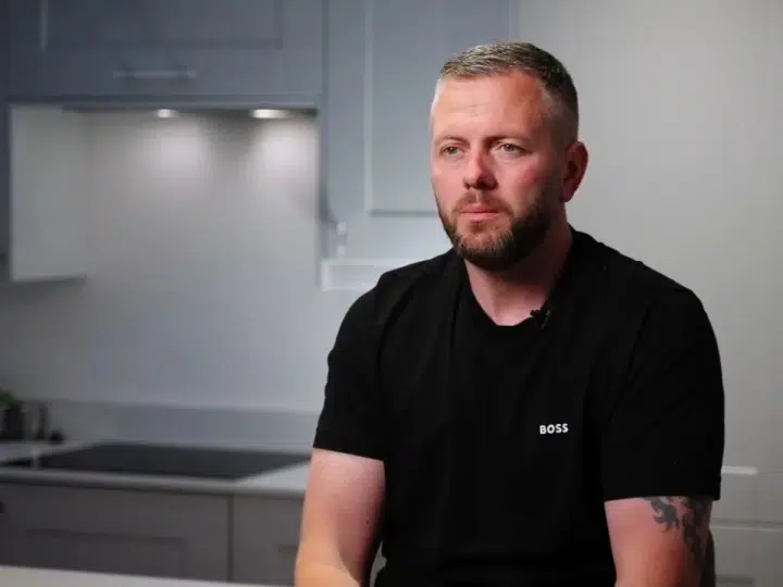 Robert Kenyon, Reform's candidate in the Makerfield by-election, sat at a kitchen counter