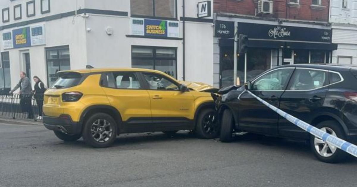 Two-car crash sees police close major junction in Horwich