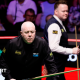 John Higgins eyes a shot