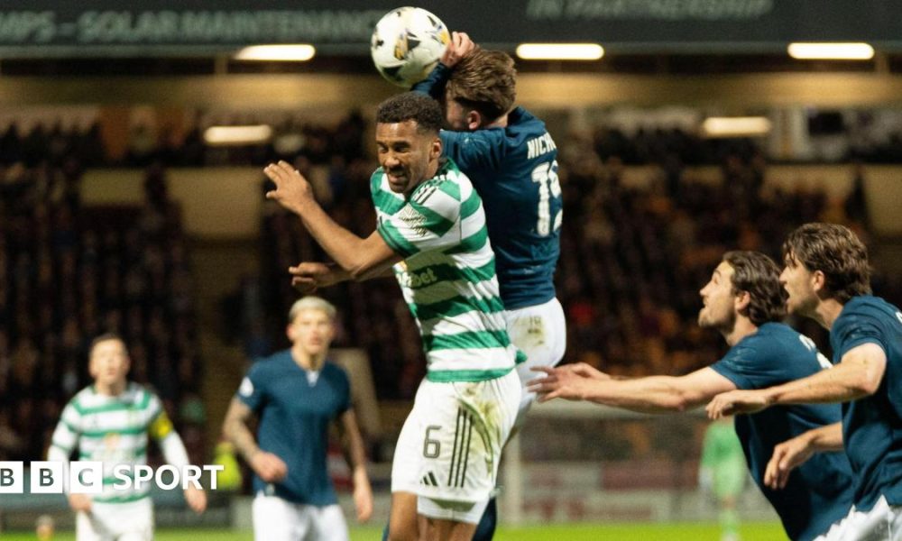 Motherwell's Sam Nicholson jumps with Celtic's Aaron Trusty