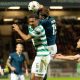 Motherwell's Sam Nicholson jumps with Celtic's Aaron Trusty