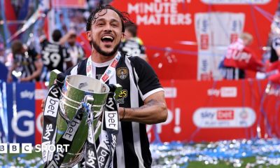 Jodi Jones holds the League Two play-off final trophy at Wembley