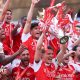 A graphic of Premier League players from every team in the division in 2025-26 season, with the Premier League trophy in front of them.
