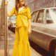 The author, age 12, in front of her family's NYC apartment building.