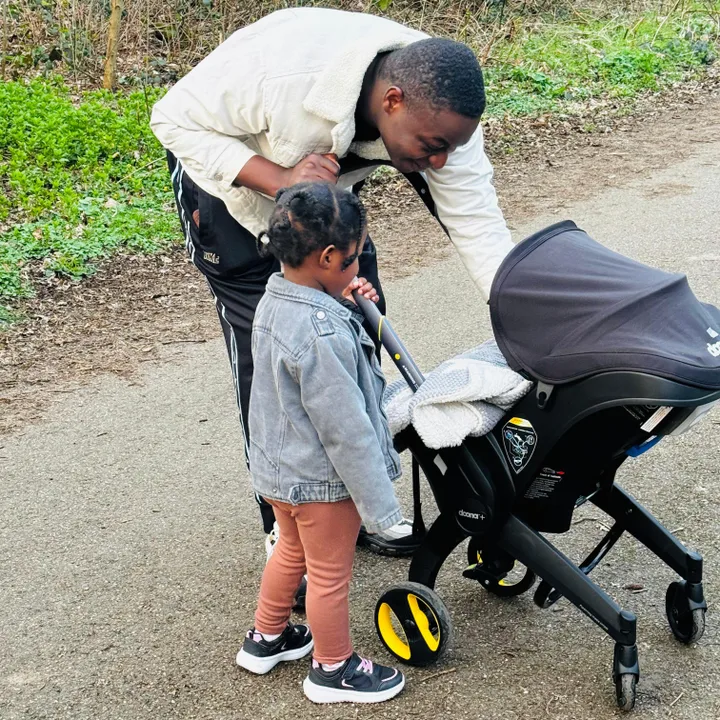 Ron Mutira and his children