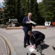 Starmer picks up the UK-US trade agreement papers dropped by Trump before speaking to the media at the G7 summit in Kananaskis, Alberta, Monday June 16, 2025.