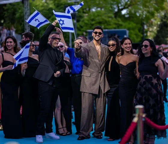 Noam Bettan posing with members of the Israeli delegation during this year's Eurovision opening ceremony