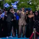 Noam Bettan posing with members of the Israeli delegation during this year's Eurovision opening ceremony