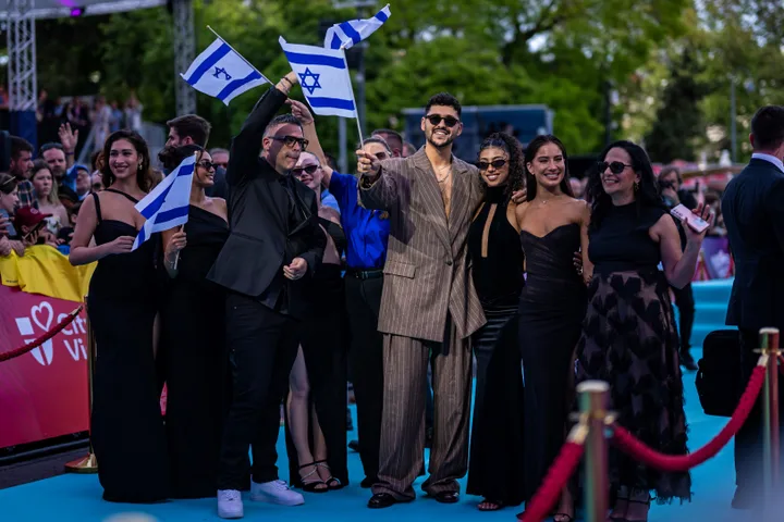 Noam Bettan posing with members of the Israeli delegation during this year's Eurovision opening ceremony