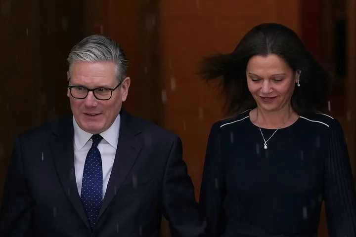 Britain's Prime Minister Keir Starmer and wife Victoria leave 10 Downing Street to attend the State Opening of Parliament at the Houses of Parliament in London, Wednesday, May 13, 2026.