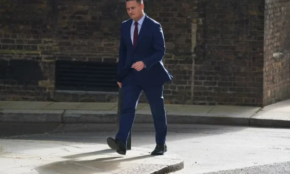 Britain's Health Secretary Wes Streeting arrives in Downing Street for a meeting with Prime Minister Keir Starmer in London, Wednesday, May 13, 2026.