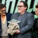 Pedro Pascal, Sigourney Weaver and Jon Favreau (with Grogu) at a The Mandalorian And Grogu fan event in London earlier this month