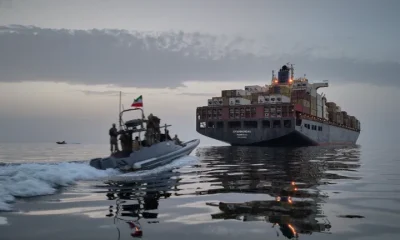 In this photo released by Tasnim News Agency, a Revolutionary Guard Navy (IRGC) speedboat approaches the cargo ship Epaminondas during what state media described as the seizure of one of two vessels accused of violations in the Strait of Hormuz on April 21.