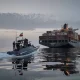 In this photo released by Tasnim News Agency, a Revolutionary Guard Navy (IRGC) speedboat approaches the cargo ship Epaminondas during what state media described as the seizure of one of two vessels accused of violations in the Strait of Hormuz on April 21.