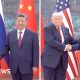 How did Xi treat Trump and Putin on their China visits?