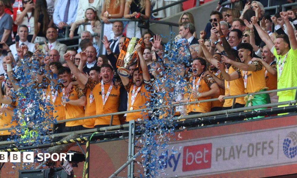 Hull players lift the trophy after winning the Championship play-offs at Wembley
