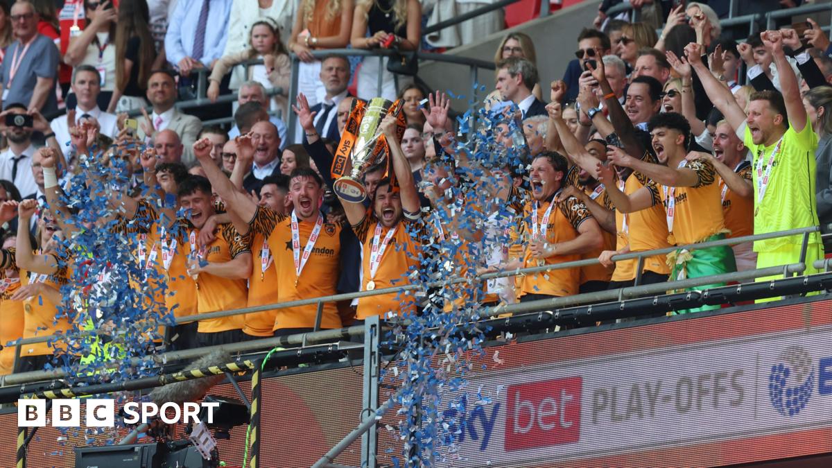 Hull players lift the trophy after winning the Championship play-offs at Wembley