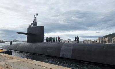 People stand on top of a US Navy Ohio-class ballistic missile submarine that arrived in Gibraltar on 10 May 2026. The Pentagon released its location.