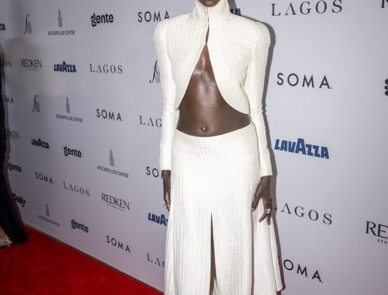 Anok Yai in a white two-piece