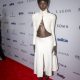 Anok Yai in a white two-piece