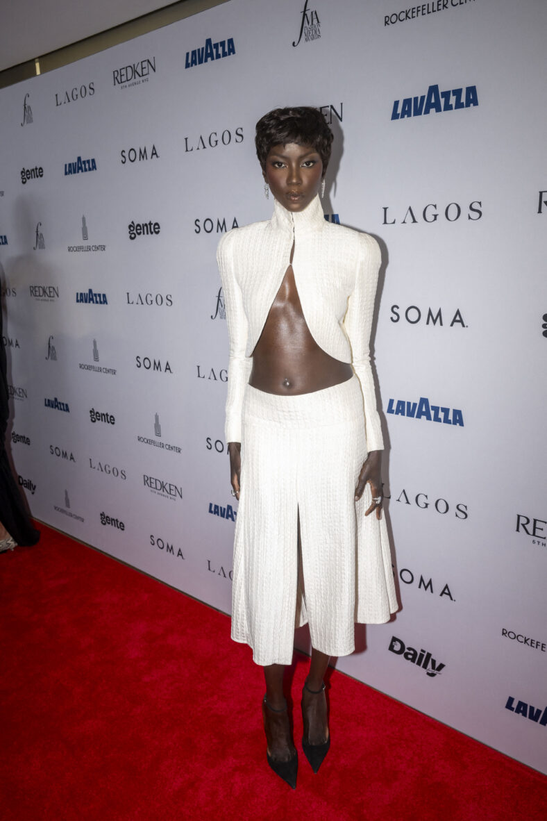 Anok Yai in a white two-piece