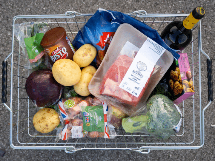 In this photo illustration, a basket of shopping filled with produce used in a traditional Sunday roast dinner for families is displayed on October 23, 2022 in Cardiff, Wales. The cost of a home-cooked Sunday roast for a family of four has reached its highest level in over a decade with inflation at 10.1%.