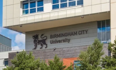 The Birmingham City University (BCU) logo on the side of one its buildings