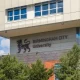 The Birmingham City University (BCU) logo on the side of one its buildings