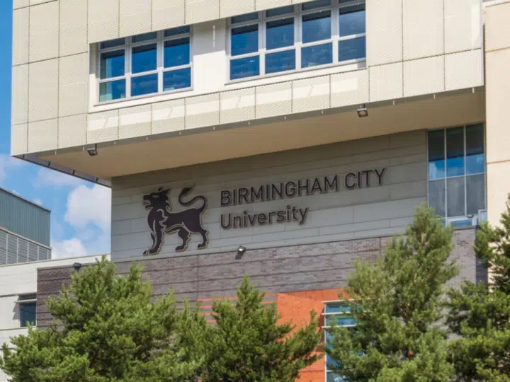 The Birmingham City University (BCU) logo on the side of one its buildings