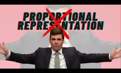 Andy Burnham with his arms out