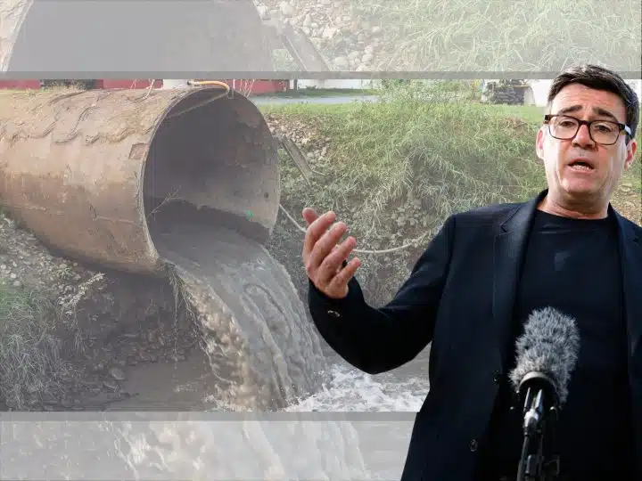 Andy Burnham in front of a sewage pipe