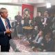 Reform leader Nigel Farage in a room full of journalists