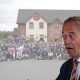 Reform UK leader Nigel Farage and an image of Restore Britain supporters