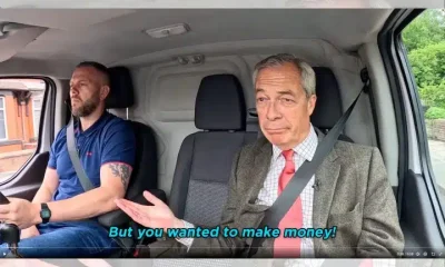 Nigel Farage and Robert Kenyon, both of Reform, sat in the front seats of a van
