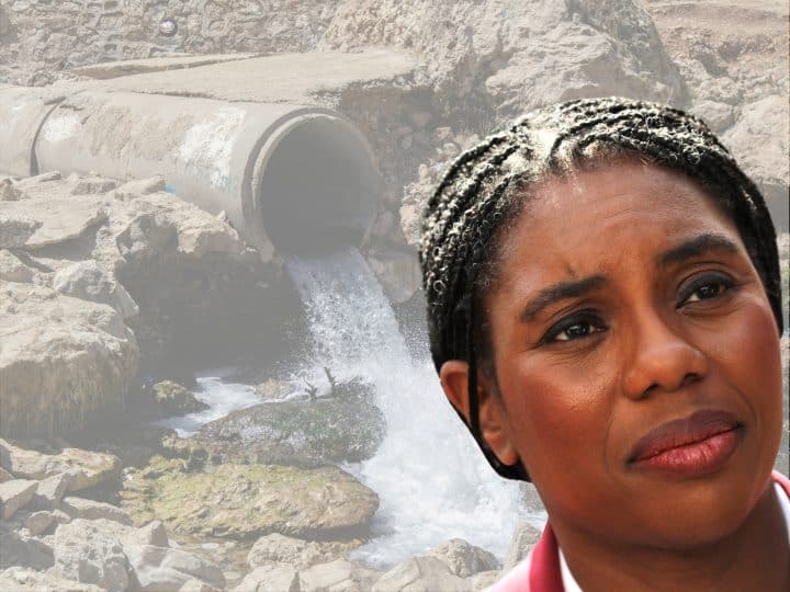 Kemi Badenoch of the Tories in front of a sewage pipe