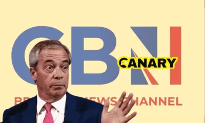 A picture of GB News' logo in the background. In the foreground we have Nigel Farage looking confused and holding up his hands. One the right hand side is the Canary logo. Reform