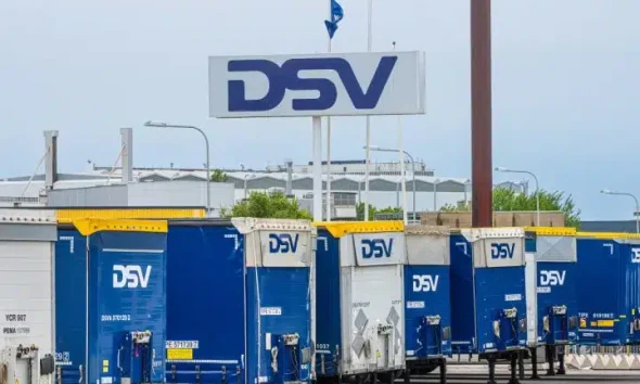 A sign for DSV logistics above a row of DSV trailers Palestine Action Global
