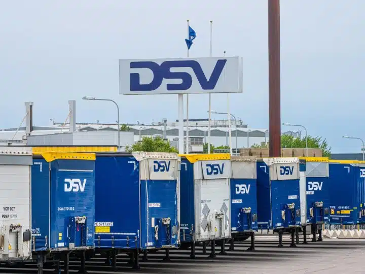 A sign for DSV logistics above a row of DSV trailers Palestine Action Global