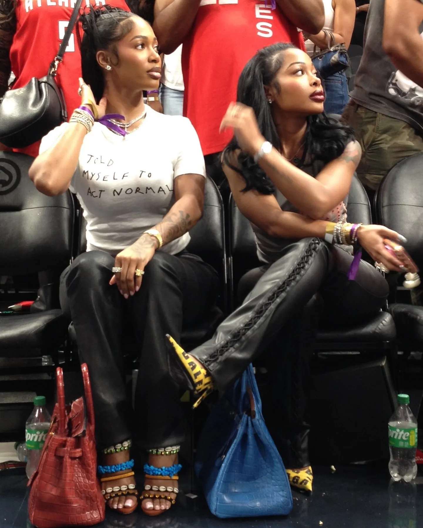 Dess Dior In Vintage Giuseppe Zanotti Shell Heels And Jayda Cheaves In Balenciaga Caution Tape Pumps At An Atlanta Dream WNBA Game Image 1779478273 1