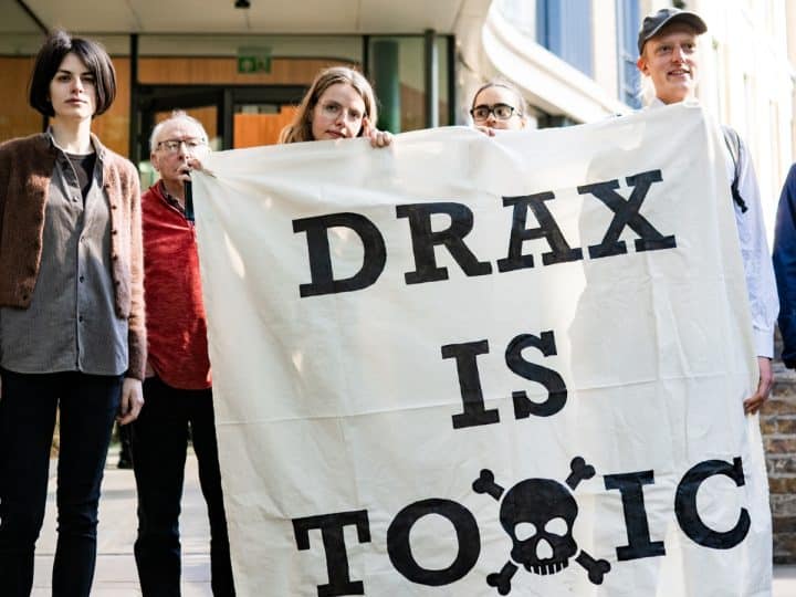Axe Drax activists hold a banner saying Drax Is Toxic