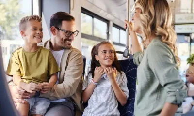 A family on a bus Summer Savings