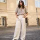 Masha Sedgwick wearing Nobi Talai blouse, Agneel bag, Closed jeans and Coach sneaker on May 06, 2020 in Berlin, Germany.