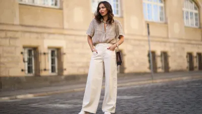 Masha Sedgwick wearing Nobi Talai blouse, Agneel bag, Closed jeans and Coach sneaker on May 06, 2020 in Berlin, Germany.