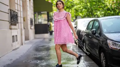 PARIS, FRANCE - MAY 05: Ketevan Giorgadze @katie.one wears a pink babydoll sleeveless mini dress with embroidery