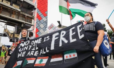British police arrest and charge 7 over ‘Globalise the intifada’ signs