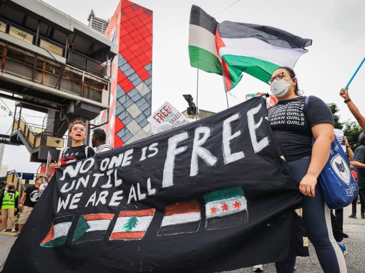 British police arrest and charge 7 over ‘Globalise the intifada’ signs