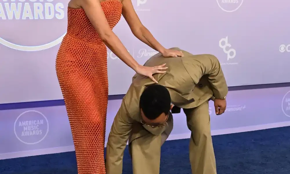 Chrissy Teigen Narrowly Misses Wardrobe Malfunction on 2026 AMAs Red Carpet Thanks to John Legend