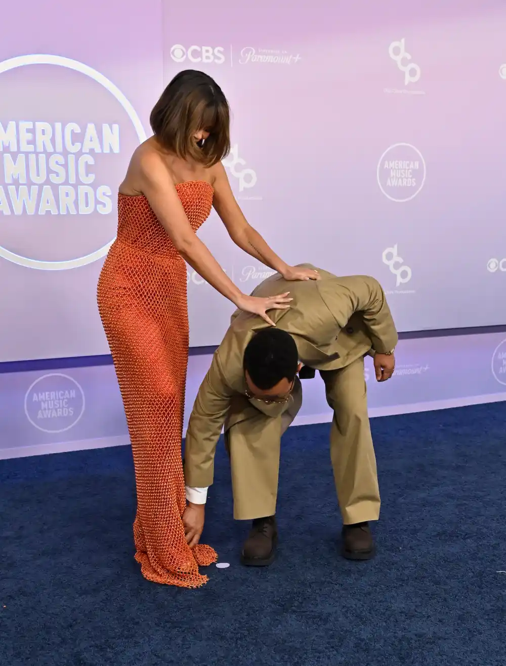 Chrissy Teigen Narrowly Misses Wardrobe Malfunction on 2026 AMAs Red Carpet Thanks to John Legend